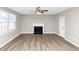 Living room featuring hardwood floors and a fireplace at 1162 Misty Meadows Xing, Hampton, GA 30228