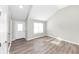 Spacious living room featuring hardwood floors and lots of natural light at 1162 Misty Meadows Xing, Hampton, GA 30228
