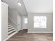 Living room with hardwood floors and a view of the front door at 1162 Misty Meadows Xing, Hampton, GA 30228