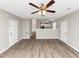 Open living room with hardwood floors and access to other rooms at 1162 Misty Meadows Xing, Hampton, GA 30228