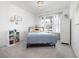 Bright bedroom with a queen bed, window seating and a white dresser at 423 Payne Rd, Woodstock, GA 30188