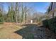 Backyard with shed, trees, and stone pathway at 3461 Valley View Dr, Marietta, GA 30068