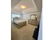 Main bedroom with tray ceiling and neutral decor at 6921 Foxmoor Way, Douglasville, GA 30134