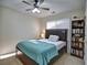 Charming bedroom with a queen-size bed and bookshelf at 1326 Nantahala Ne Trl, Marietta, GA 30062