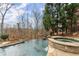 Relaxing pool and spa area with flagstone patio and wooded backdrop at 2960 Millwater Xing, Dacula, GA 30019