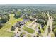 Aerial view of a country club, parking, and a golf course in a lush green landscape at 2960 Millwater Xing, Dacula, GA 30019
