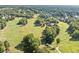 Scenic aerial view of the golf course community with lush greenery and beautiful homes at 2960 Millwater Xing, Dacula, GA 30019