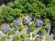 Aerial view of a private home surrounded by lush greenery and well-maintained landscaping at 2960 Millwater Xing, Dacula, GA 30019