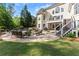 Expansive backyard patio with outdoor furniture and a grill at 2960 Millwater Xing, Dacula, GA 30019
