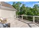 Relaxing balcony with tile flooring and peaceful views of the surrounding nature at 2960 Millwater Xing, Dacula, GA 30019
