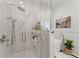 Modern bathroom featuring glass shower and soaking tub at 2960 Millwater Xing, Dacula, GA 30019
