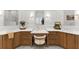 Elegant bathroom with dual sinks, vanity, and wood cabinets at 2960 Millwater Xing, Dacula, GA 30019
