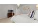 Bright bedroom with a four-poster bed, dresser, and a soft color scheme at 2960 Millwater Xing, Dacula, GA 30019