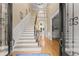 Elegant foyer with hardwood floors, staircase, and ample natural light at 2960 Millwater Xing, Dacula, GA 30019