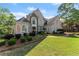 Two-story home with lush front yard and manicured landscaping at 2960 Millwater Xing, Dacula, GA 30019