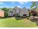 Two-story home with a large front yard, lush landscaping, and inviting curb appeal at 2960 Millwater Xing, Dacula, GA 30019