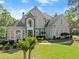 Beautiful two-story home featuring a well-manicured front lawn and inviting walkway at 2960 Millwater Xing, Dacula, GA 30019