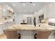 Bright eat-in kitchen features a large island, stone countertops and stainless steel appliances at 2960 Millwater Xing, Dacula, GA 30019