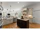 Gourmet kitchen with stainless appliances, custom cabinetry, and adjacent living space at 2960 Millwater Xing, Dacula, GA 30019