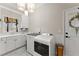 Laundry room with lots of counter space, storage and natural light at 2960 Millwater Xing, Dacula, GA 30019