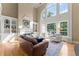 Spacious living room featuring a fireplace, built-in shelving, and large windows at 2960 Millwater Xing, Dacula, GA 30019