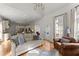 Bright living room with hardwood floors, fireplace, and view to the kitchen at 2960 Millwater Xing, Dacula, GA 30019