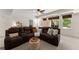Comfortable living room featuring a large sectional sofa and natural light from the windows at 2960 Millwater Xing, Dacula, GA 30019