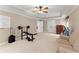 Bright living room with a whiteboard, exercise equipment, and a comfortable sofa, great for relaxation and fitness at 2960 Millwater Xing, Dacula, GA 30019