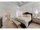 Main bedroom featuring large windows with a tray ceiling at 2960 Millwater Xing, Dacula, GA 30019