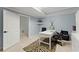 Bright office space with modern desk, zebra-print rug, and tranquil blue walls at 2960 Millwater Xing, Dacula, GA 30019