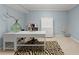 Bright office featuring a sleek desk, ample storage, and a stylish zebra-print rug at 2960 Millwater Xing, Dacula, GA 30019
