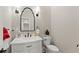 Stylish half bathroom with decorative wallpaper, marble vanity, and modern fixtures at 2960 Millwater Xing, Dacula, GA 30019