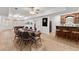 Large recreation space with a poker table, bar area, and wood flooring, creating a versatile entertainment hub at 2960 Millwater Xing, Dacula, GA 30019