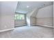 Spacious room with neutral carpeting, natural light from windows, and freshly painted walls at 2106 Lacroix Way, Conyers, GA 30094