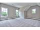Bright room with neutral carpet, trim, paint, natural light from windows, and high ceilings at 2106 Lacroix Way, Conyers, GA 30094