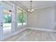 Well-lit dining room with a glass door leading to the backyard at 2106 Lacroix Way, Conyers, GA 30094
