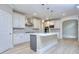 Well-appointed kitchen with white cabinetry, center island, and modern appliances at 2106 Lacroix Way, Conyers, GA 30094