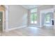 Bright living area with large windows and detailed trim, offering an open view into other living spaces at 2106 Lacroix Way, Conyers, GA 30094