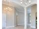 Open-concept living area featuring elegant lighting and archways, showcasing seamless transitions between rooms at 2106 Lacroix Way, Conyers, GA 30094