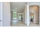 Spacious living area with elegant columns, arched doorways, and natural light, offering a seamless flow at 2106 Lacroix Way, Conyers, GA 30094
