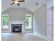 Bright living room featuring a stone fireplace, large windows, and modern finishes at 2106 Lacroix Way, Conyers, GA 30094