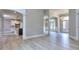 Open-concept living space with hardwood floors and decorative columns and arches at 2106 Lacroix Way, Conyers, GA 30094