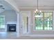 Living room view leading to a covered porch, showcasing natural light and open space at 2106 Lacroix Way, Conyers, GA 30094