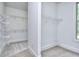 A carpeted walk-in closet features wire shelving for optimal storage and organization at 2106 Lacroix Way, Conyers, GA 30094