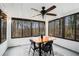 Sunroom with wooden table, four chairs, and wooded views at 570 N Burnt Hickory Rd, Douglasville, GA 30134