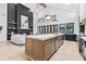 Modern kitchen with a large island, stainless steel appliances, and herringbone floors at 904 Kings Court Ne, Atlanta, GA 30306