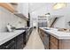 Modern kitchen with dark cabinetry, marble countertops, and an island at 904 Kings Court Ne, Atlanta, GA 30306