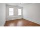 Well-lit bedroom with hardwood floors and neutral color scheme at 2733 Caldwell Rd, Brookhaven, GA 30319