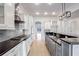 Modern kitchen with white cabinets and dark countertops at 2733 Caldwell Rd, Brookhaven, GA 30319