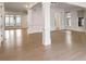 Large living area with hardwood floors and columns at 2733 Caldwell Rd, Brookhaven, GA 30319